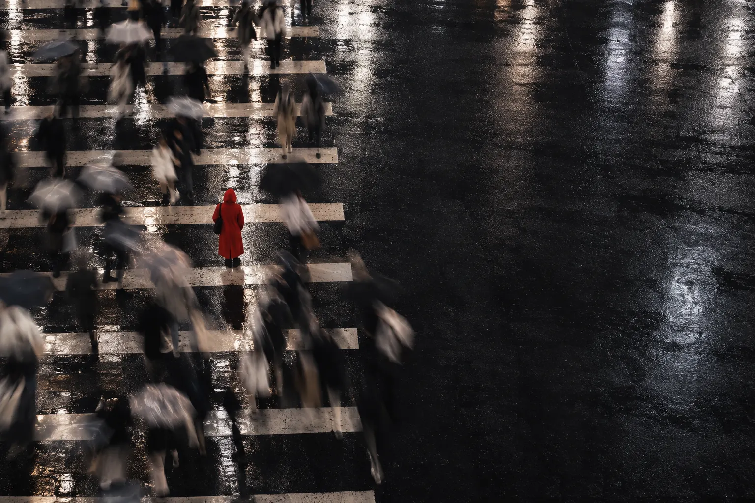 A rain-soaked Shenzhen crossing at night, crowds moving in a blur